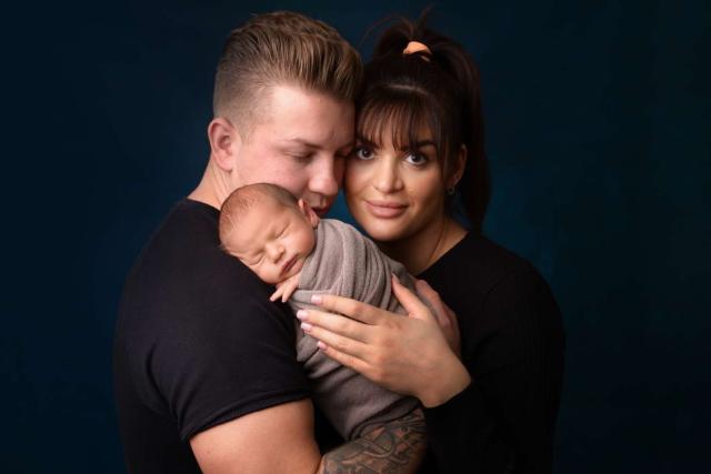 Newborn baby with parents photo in London